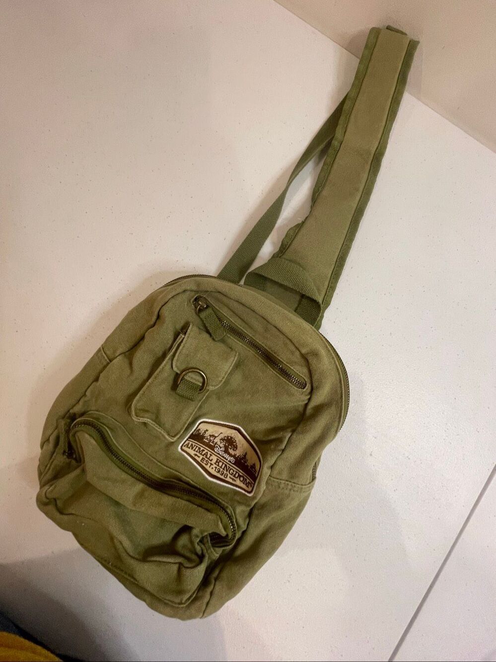 Disney Animal Kingdom EST. 1998 Olive Green Canvas Sling Backpack Crossbody Bag